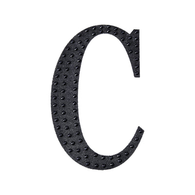 Black textured letter 'C' cutout on a plain background.