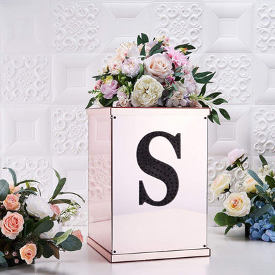 Decorative floral box with an "S" design, featuring a variety of flowers.
