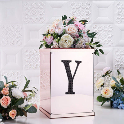 Rose gold floral display box with elegant flowers and a letter "Y" design.