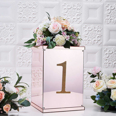 Rose gold number one display box with floral arrangement, elegant decoration.