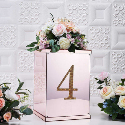 Rose gold floral centerpiece box with number 4 and decorative flowers.
