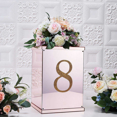Decorative floral arrangement in a mirrored box with the number 8.