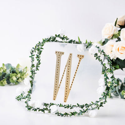 Gold letter "W" on clear acrylic with floral accents