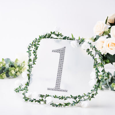 Silver number one table centerpiece with floral garland decoration