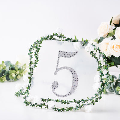 Elegant table number 5 with floral accents on a white backdrop