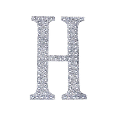 Silver rhinestone letter "H" on a plain white background.