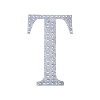 Silver rhinestone letter "T" cutout on a white background.