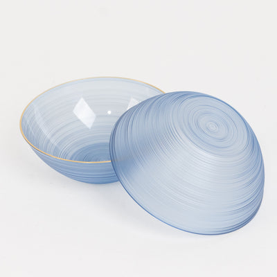 Blue decorative bowls with a swirl design and gold trim, open and closed.