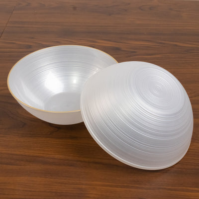 Two elegant, translucent serving bowls with a gold rim.