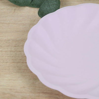 Pink scalloped plate on wooden surface