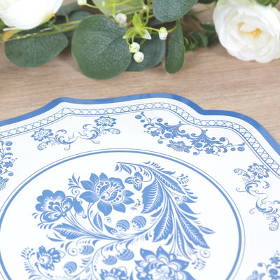 Blue floral decorative plate on wooden surface.