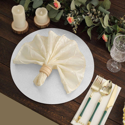 Elegant cream napkin elegantly arranged on a decorative plate with tableware.