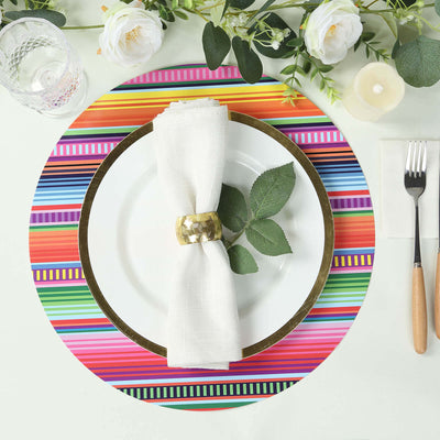 Colorful striped placemat with a white plate, napkin, and decorative elements.