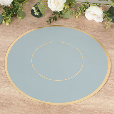 Elegant blue round placemat with gold trim on a wooden table.