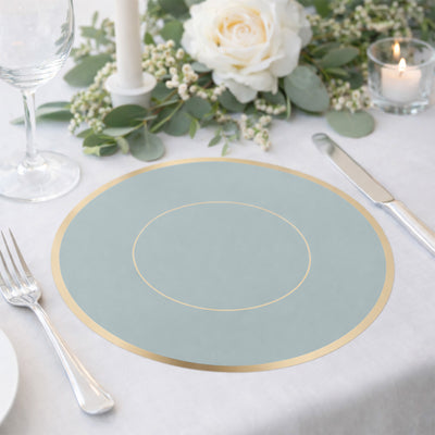 Elegant blue placemat with gold accent on a beautifully set dining table.