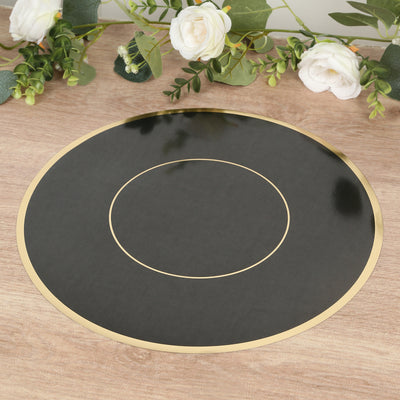 Black circular placemat with gold trim on a wooden surface.