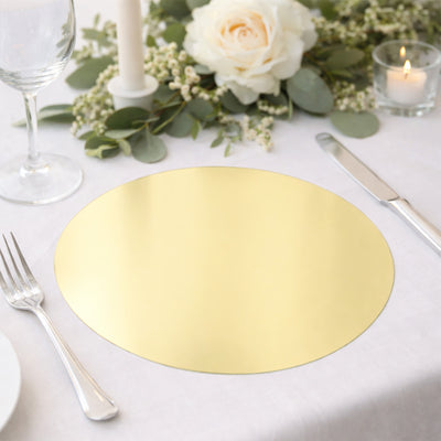 Gold round table placemat on a beautifully set dining table with floral decor.