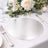 Elegant silver placemat on a beautifully set table with floral decor.