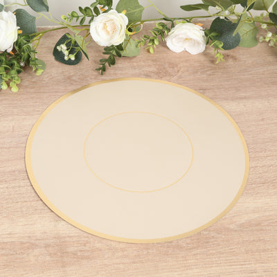 Round beige placemat with gold trim on a wooden surface.