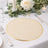 Elegant round table placemat with gold trim on a beautifully set dining table.