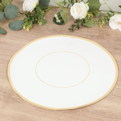 White plate with gold rim on a wooden table surrounded by greenery.