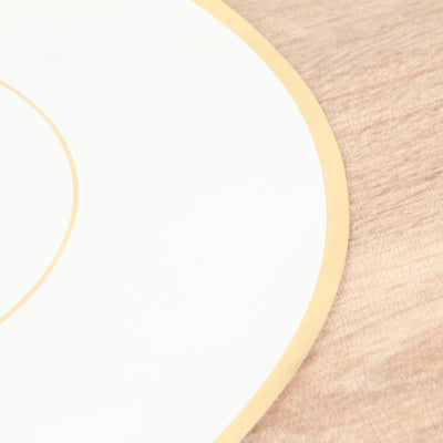 Gold-trimmed white plate on a wooden surface.