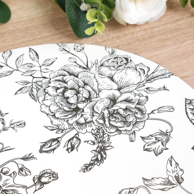Black and white floral design on a round plate.