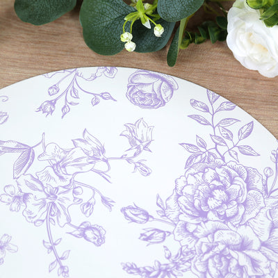 Floral patterned round placemat in lavender on a wooden table.