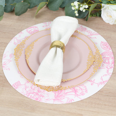 Elegant floral dinner plate set with napkin holder on wooden table.
