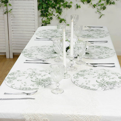 Elegant floral table setting with glassware and candles. Perfect for dining occasions.
