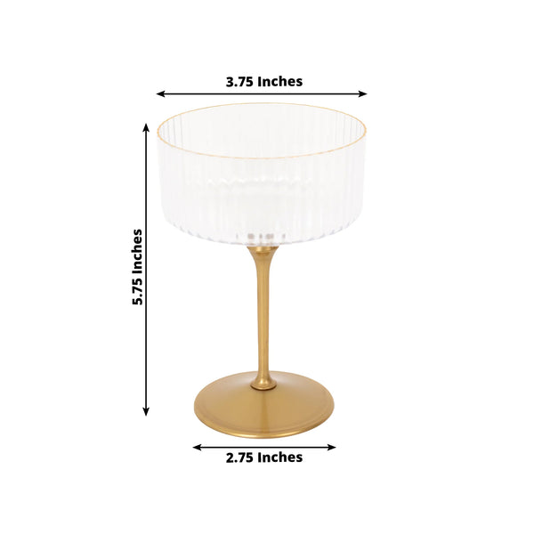 Gold and clear glass dessert cup, 5.75 inches tall, 3.75 inches wide.