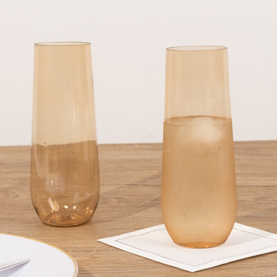 Amber glass tumblers on a wooden table