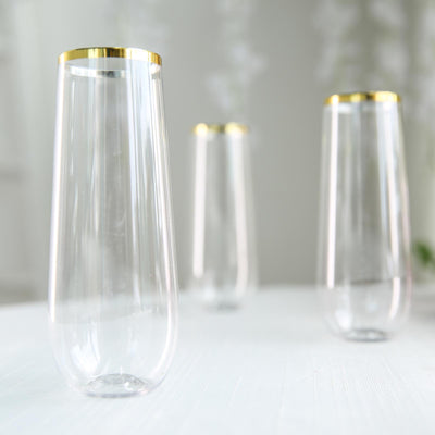 Transparent vases with gold rims on a soft background