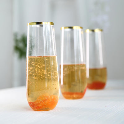 Elegant champagne flutes with golden rims and sparkling drink