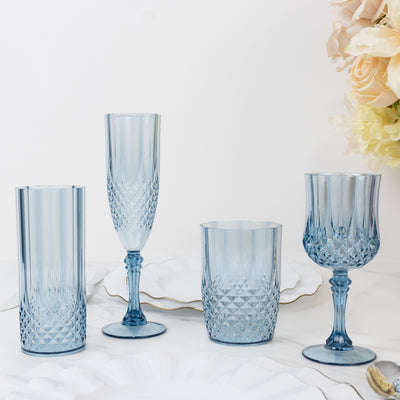 Set of four elegant blue glassware pieces on a white background.