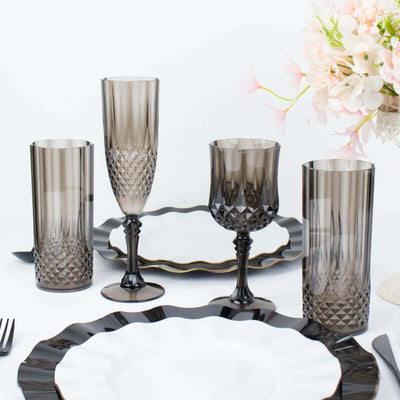 Elegant smoke-colored glassware set on stylish plates.