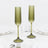 Olive green ribbed glass champagne flutes with fluted stems and pedestal bases