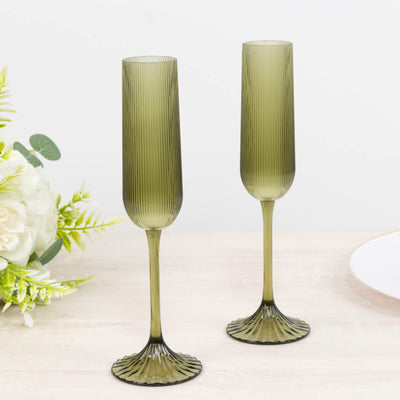 Pair of olive green ribbed champagne flutes with elegant long stems