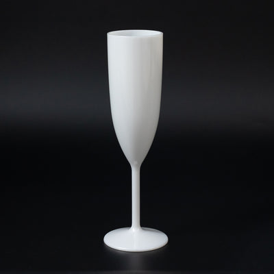 White champagne flute on a black background.