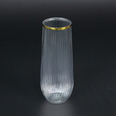 Elegant ribbed glass vase with gold rim.