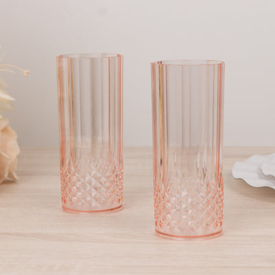 Set of two pink crystal glasses with a textured design.
