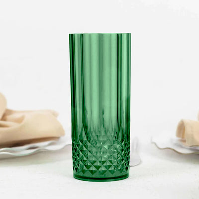 Green crystal glass tumbler with a diamond pattern.