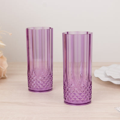 Purple textured drinking glasses set against a light backdrop.