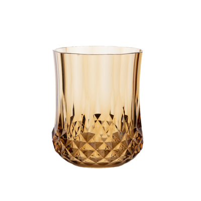 Amber crystal tumbler with a faceted design.