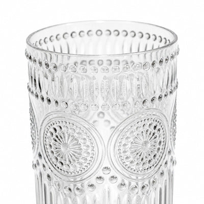 Clear decorative embossed glass tumbler with floral and dot pattern