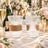 Elegant ribbed crystal drinking glasses with leather bands on a romantic table setting