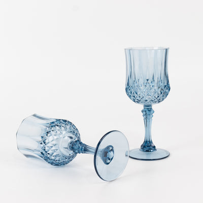 Elegant blue crystal wine glasses on a white background.