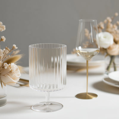 Elegant ribbed glassware set on a stylish dining table.
