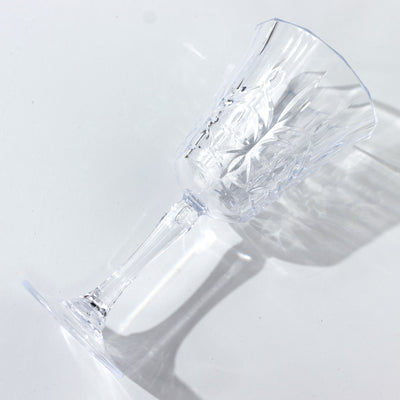 Elegant crystal wine glass with intricate design and clear shine