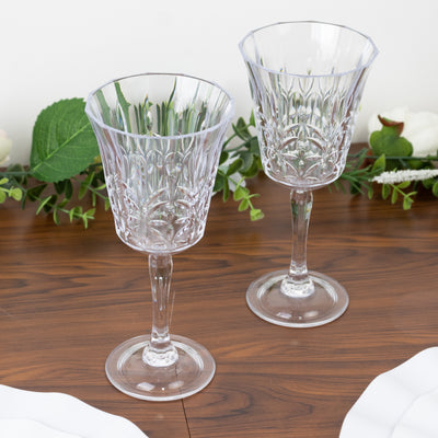 Elegant crystal wine glasses on a wooden table.